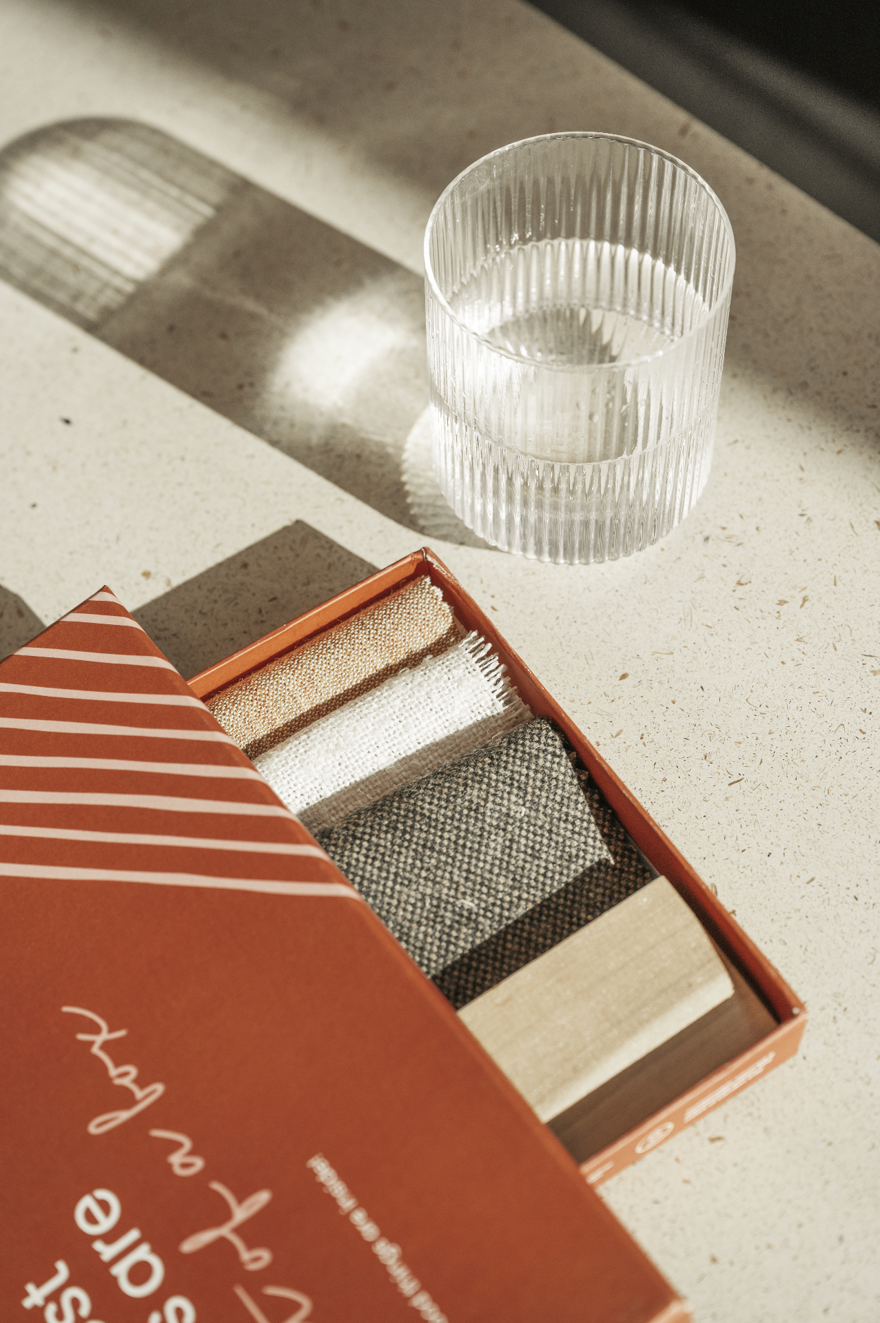 Box of standard fabric sample swatches